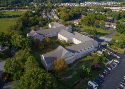 Aerial view of building and main drive in bright sun