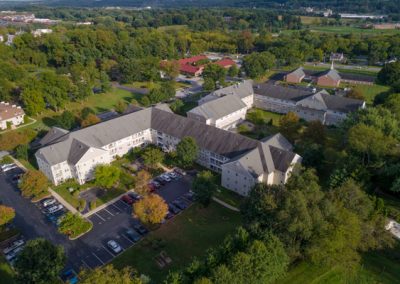 Aerial view of building and main drive in bright sun