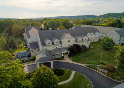 Aerial view of building and main drive in bright sun