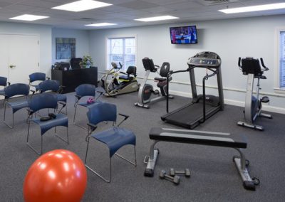 Gym area with weights and cardio equipment