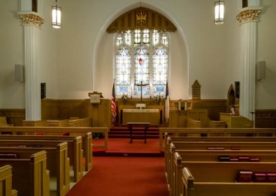 View of chapel, stained glass and pews