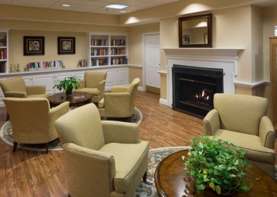 Gathering area with overstuffed chairs and fireplace